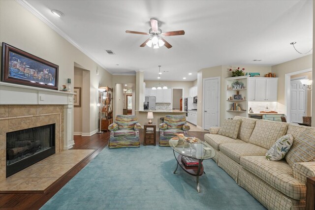 3102 Hidden Springs Dr, Corinth, TX 76210 - living area featuring ceiling fan, a fireplace, and crown molding