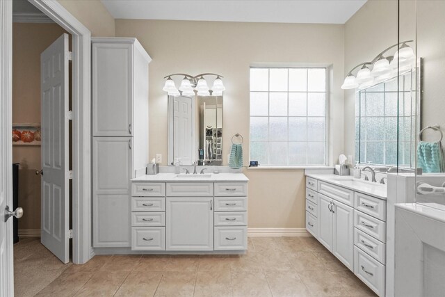 3102 Hidden Springs Dr, Corinth, TX 76210 - bathroom featuring two vanities and tile patterned flooring