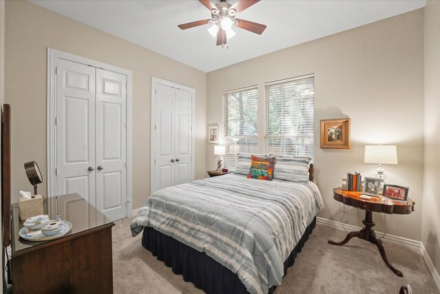 3102 Hidden Springs Dr, Corinth, TX 76210 - carpeted bedroom with two closets and ceiling fan