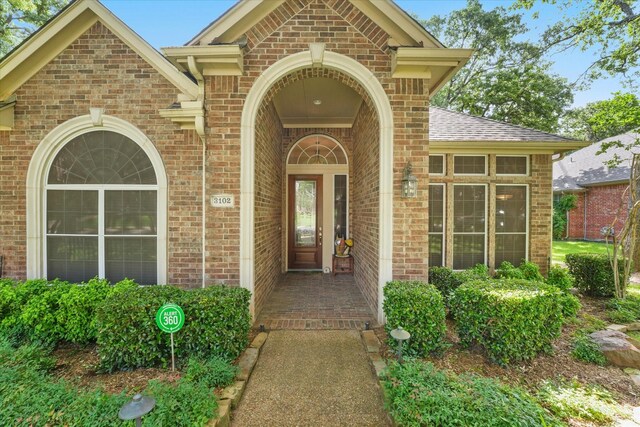 3102 Hidden Springs Dr, Corinth, TX 76210 - entrance to property featuring brick siding and roof with shingles
