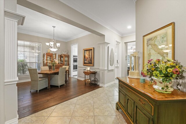 3102 Hidden Springs Dr, Corinth, TX 76210 - dining area featuring light tile patterned flooring, a chandelier, and crown molding