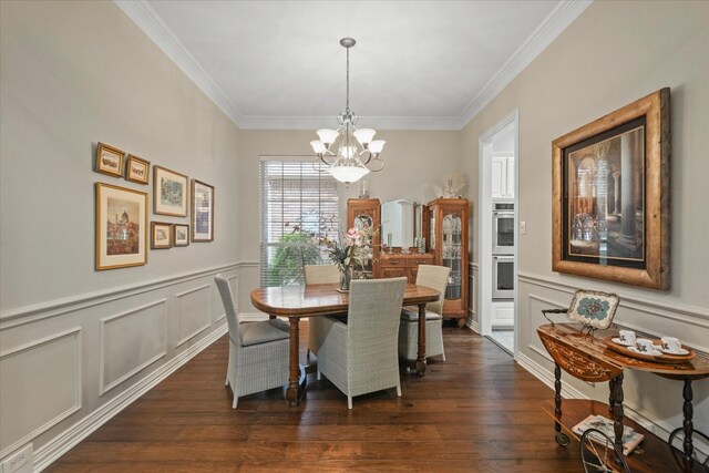 3102 Hidden Springs Dr, Corinth, TX 76210 - dining area with a chandelier, crown molding, a decorative wall, dark wood-style floors, and wainscoting