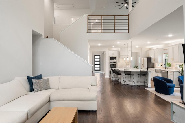 3603 High Dr, Grapevine, TX 76051 - living room featuring a high ceiling, dark wood-style floors, recessed lighting, a ceiling fan, and stairway