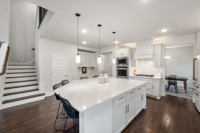 3603 High Dr, Grapevine, TX 76051 - kitchen with stainless steel appliances, premium range hood, dark wood-style floors, white cabinets, and recessed lighting