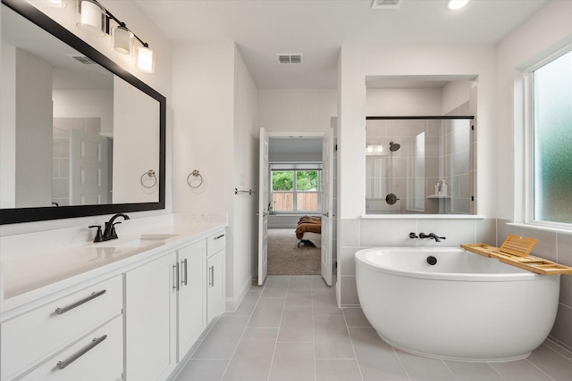 3603 High Dr, Grapevine, TX 76051 - full bath with ensuite bathroom, vanity, a soaking tub, tile patterned flooring, and tiled shower