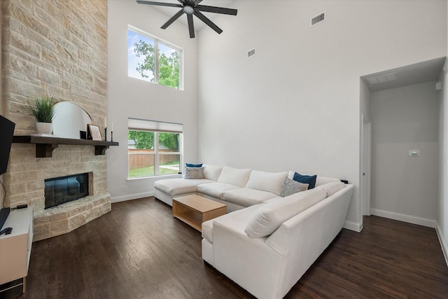 3603 High Dr, Grapevine, TX 76051 - living area with a ceiling fan, dark wood-style flooring, a high ceiling, and a fireplace