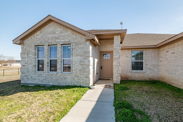 656 Bunk House Dr, Venus, TX 76084 - entrance to property with a yard and roof with shingles