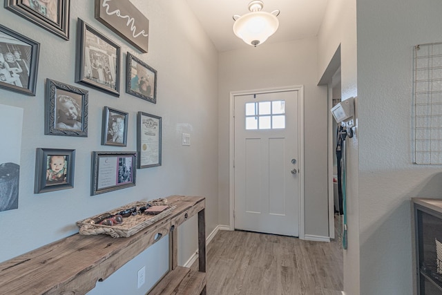 656 Bunk House Dr, Venus, TX 76084 - foyer entrance with light wood-type flooring and baseboards