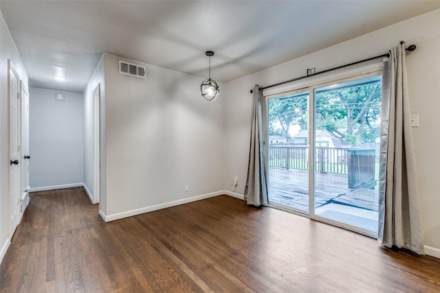 3641 La Prada Dr, Mesquite, TX 75150 - empty room with dark wood-style flooring and baseboards