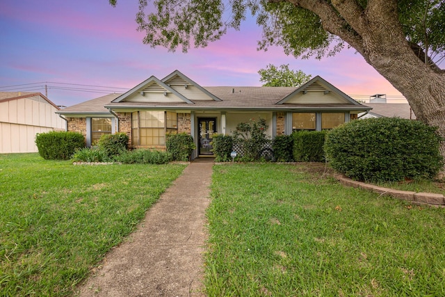 2114 Norway Dr, Garland, TX 75040 - ranch-style home featuring a yard, brick siding, and roof with shingles