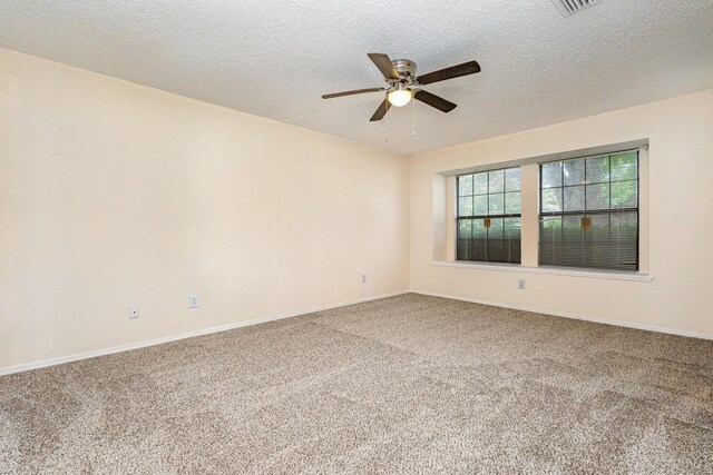 2114 Norway Dr, Garland, TX 75040 - spare room featuring ceiling fan, carpet flooring, and a textured ceiling