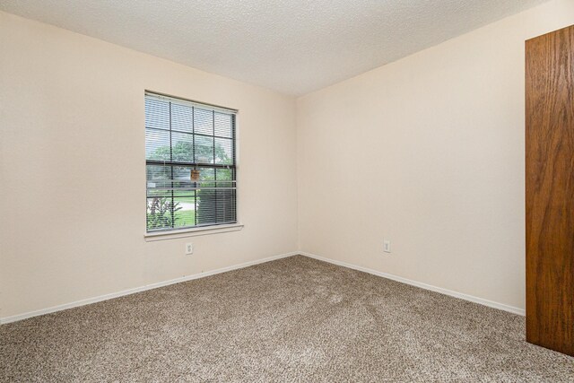 2114 Norway Dr, Garland, TX 75040 - carpeted spare room with baseboards