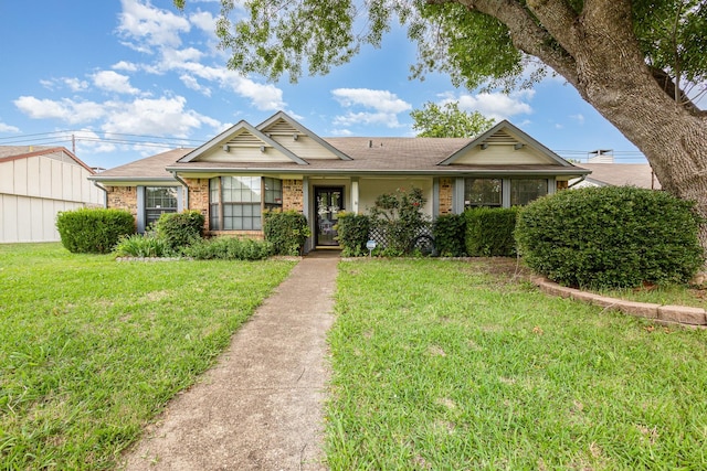 2114 Norway Dr, Garland, TX 75040 - ranch-style house featuring a front lawn, brick siding, and roof with shingles