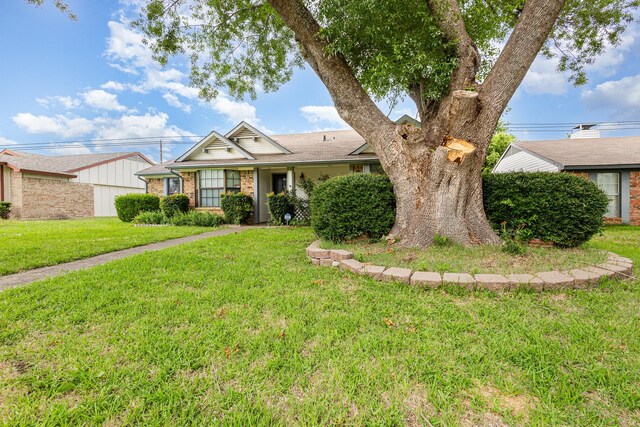 2114 Norway Dr, Garland, TX 75040 - ranch-style house with a front lawn and brick siding