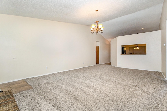 2114 Norway Dr, Garland, TX 75040 - unfurnished living room featuring a chandelier, carpet floors, and lofted ceiling