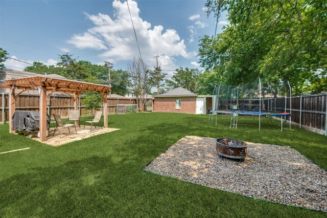 6201 Reiger Ave, Dallas, TX 75214 - fenced backyard featuring a fire pit, a trampoline, a patio area, an outdoor structure, and a pergola