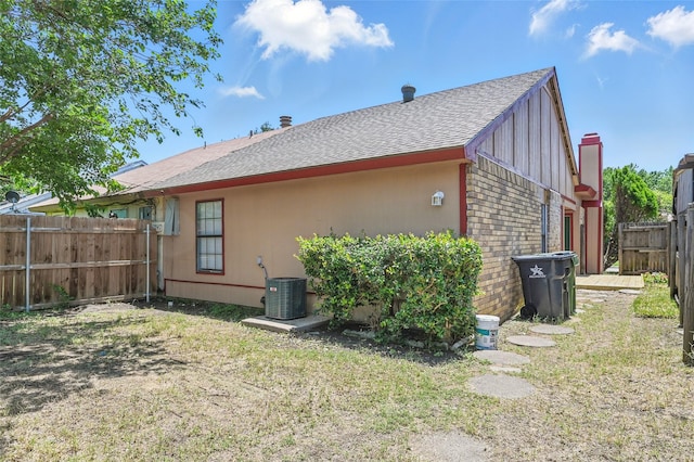 2415 Sunflower Dr, Arlington, TX 76014 - back of house featuring a shingled roof and a fenced backyard