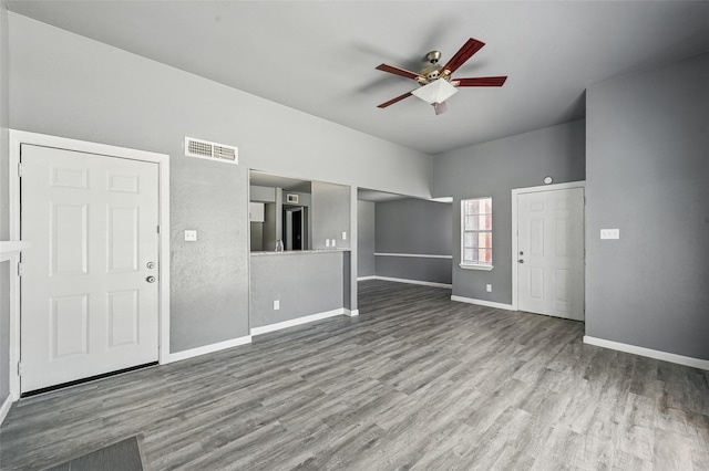 2415 Sunflower Dr, Arlington, TX 76014 - unfurnished living room featuring a ceiling fan and wood finished floors
