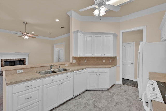 9841 Freedoms Way, Keithville, LA 71047 - kitchen featuring a ceiling fan, white appliances, a peninsula, light countertops, and a fireplace