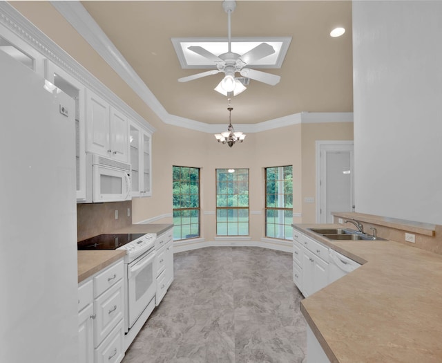 9841 Freedoms Way, Keithville, LA 71047 - kitchen featuring white appliances, a skylight, white cabinetry, a ceiling fan, and ornamental molding
