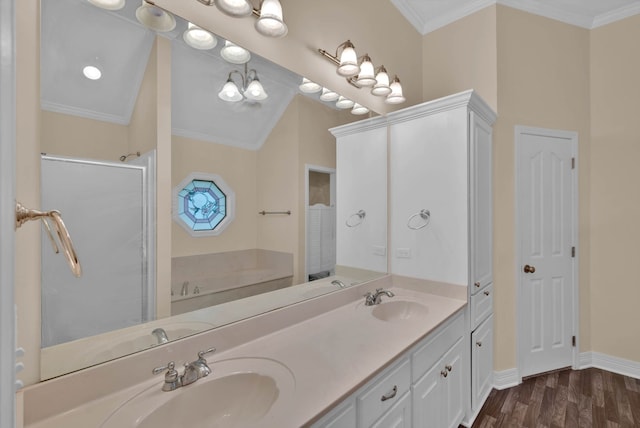 9841 Freedoms Way, Keithville, LA 71047 - bathroom with a bath, double vanity, a shower stall, crown molding, and wood finished floors