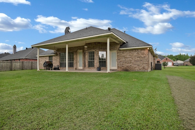9841 Freedoms Way, Keithville, LA 71047 - back of house featuring a patio, brick siding, and roof with shingles
