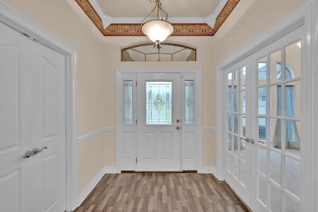 9841 Freedoms Way, Keithville, LA 71047 - entryway featuring wood finished floors, french doors, and crown molding