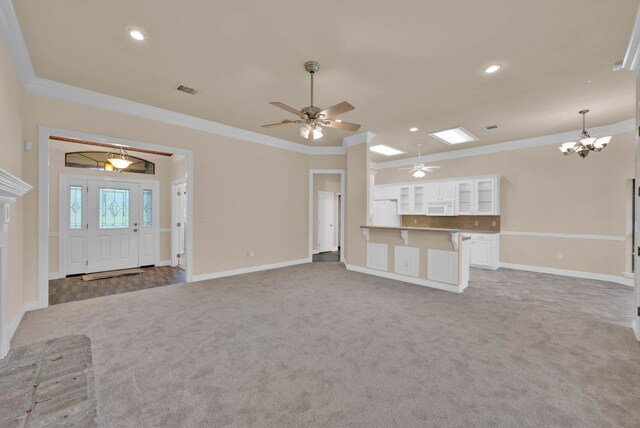9841 Freedoms Way, Keithville, LA 71047 - unfurnished living room featuring carpet floors, crown molding, ceiling fan, a chandelier, and recessed lighting