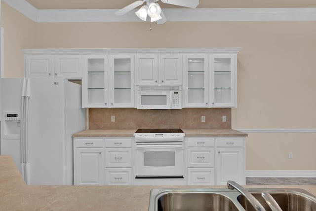 9841 Freedoms Way, Keithville, LA 71047 - kitchen with white appliances, light countertops, a ceiling fan, white cabinets, and crown molding