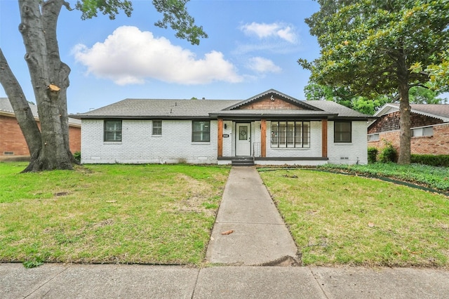 8434 Sweetwood Dr, Dallas, TX 75228 - view of front of home featuring brick siding, a front yard, covered porch, and roof with shingles