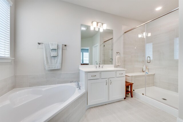 309 Savannah Ln, Oak Point, TX 75068 - bathroom with a garden tub, vanity, a shower stall, and tile patterned floors