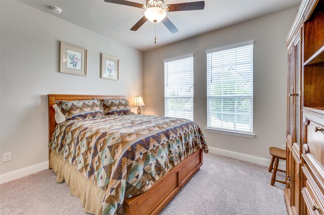 309 Savannah Ln, Oak Point, TX 75068 - bedroom featuring light colored carpet, multiple windows, and ceiling fan