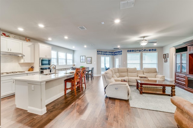 309 Savannah Ln, Oak Point, TX 75068 - living area featuring wood finished floors, recessed lighting, and a ceiling fan