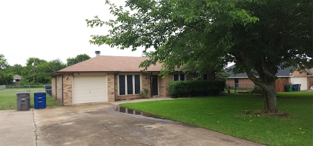 414 Butterfly Ln, Red Oak, TX 75154 - single story home with concrete driveway, an attached garage, and brick siding