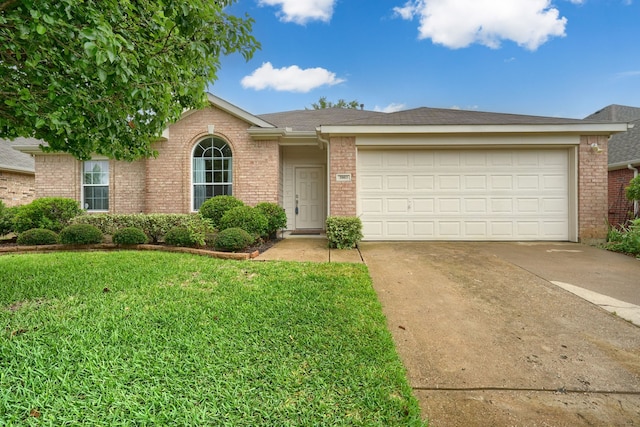 3003 Margot Ct, Wylie, TX 75098 - ranch-style home with brick siding, driveway, a front yard, and a garage