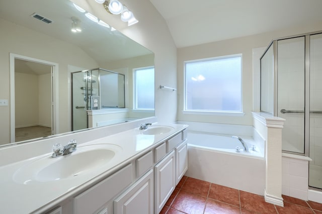3003 Margot Ct, Wylie, TX 75098 - bathroom featuring a shower stall, a bath, vaulted ceiling, double vanity, and tile patterned floors