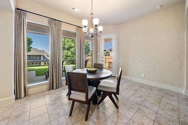 5048 Exposition Way, Fort Worth, TX 76244 - dining area featuring a chandelier, a textured wall, and light tile patterned floors