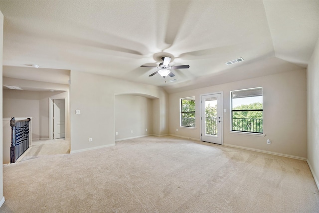 5048 Exposition Way, Fort Worth, TX 76244 - unfurnished room with light carpet, ceiling fan, and arched walkways