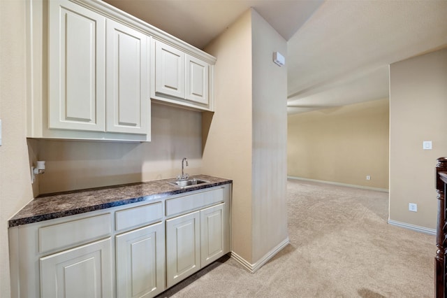 5048 Exposition Way, Fort Worth, TX 76244 - kitchen with light carpet, dark countertops, and white cabinetry