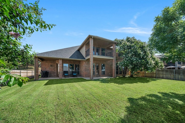 5048 Exposition Way, Fort Worth, TX 76244 - rear view of property with brick siding, a balcony, a fenced backyard, a patio area, and a shingled roof