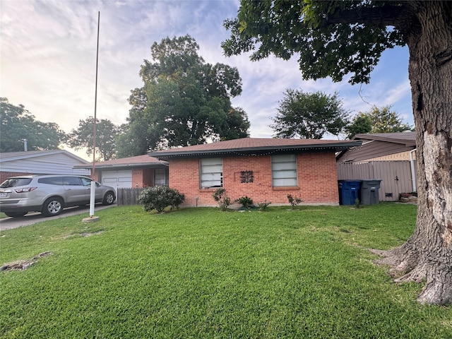 2643 Hillsboro Ave, Dallas, TX 75228 - ranch-style home featuring brick siding and a garage