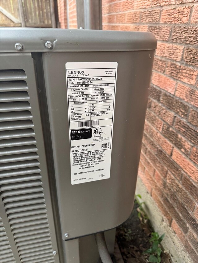 2643 Hillsboro Ave, Dallas, TX 75228 - exterior view of brick siding and a central air condition unit