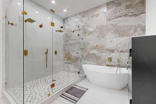 3828 Eaton Dr, Dallas, TX 75220 - bathroom featuring a freestanding tub, tile walls, a shower stall, marble finish flooring, and recessed lighting