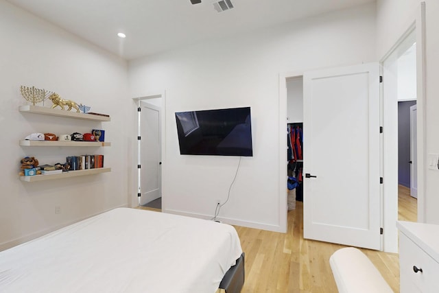 3828 Eaton Dr, Dallas, TX 75220 - bedroom with light wood finished floors and recessed lighting
