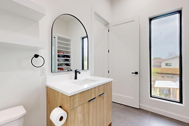 3828 Eaton Dr, Dallas, TX 75220 - bathroom featuring vanity, tile patterned floors, healthy amount of natural light, and a closet