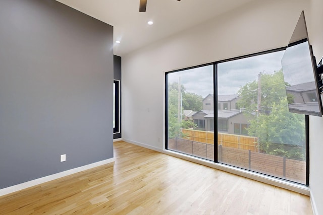 3828 Eaton Dr, Dallas, TX 75220 - empty room with light wood-style flooring, a ceiling fan, and recessed lighting