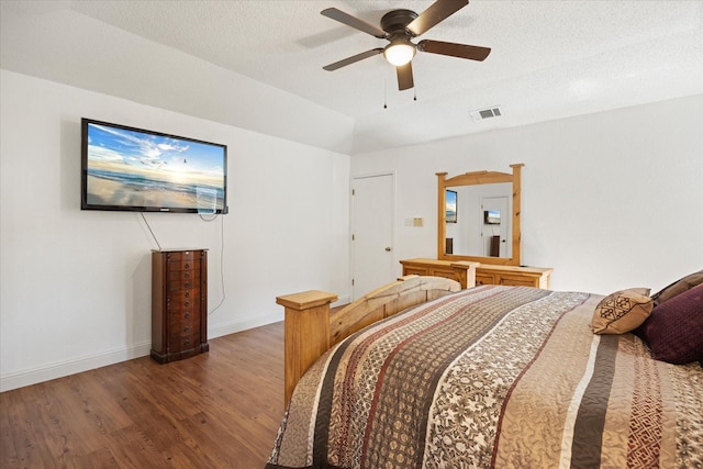213 NE Alsbury Blvd, Burleson, TX 76028 - bedroom featuring wood finished floors, ceiling fan, and a textured ceiling