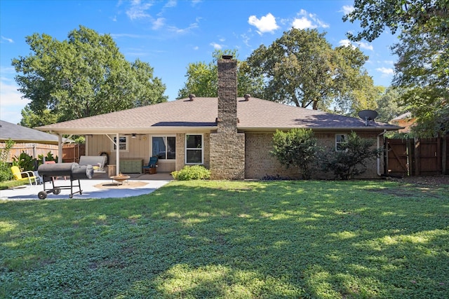 213 NE Alsbury Blvd, Burleson, TX 76028 - back of house featuring a patio area, a chimney, an outdoor hangout area, a ceiling fan, and brick siding