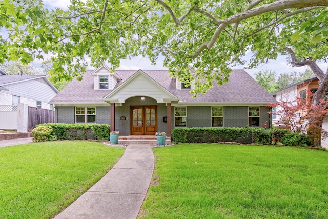 8928 Aldwick Cir, Dallas, TX 75238 - cape cod home featuring brick siding, roof with shingles, and french doors