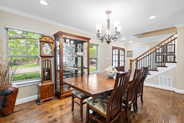 8928 Aldwick Cir, Dallas, TX 75238 - dining room featuring a chandelier, wood finished floors, crown molding, stairway, and recessed lighting